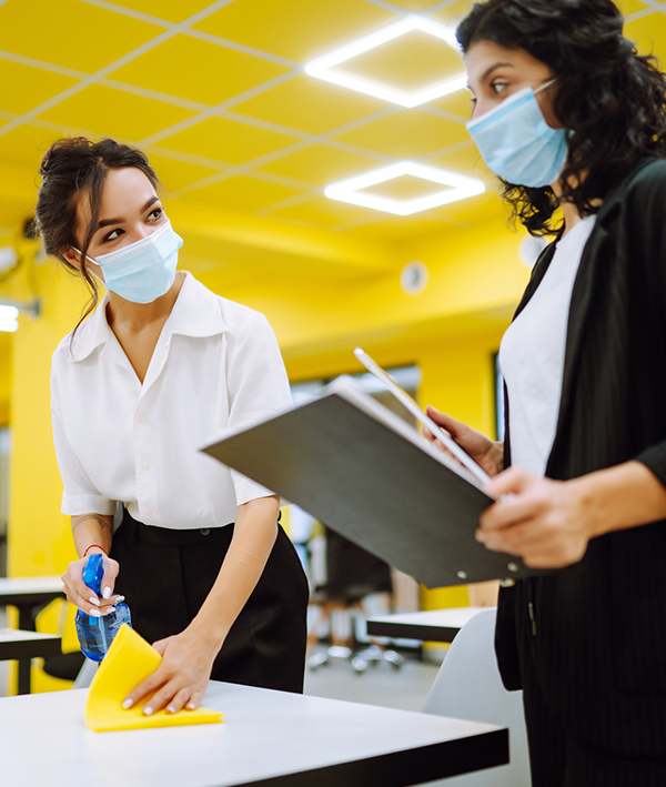 woman training cleaning staff