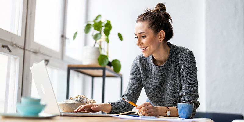 woman watching webinar on laptop