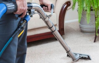 Training for carpet cleaning – professional technician using carpet extractor