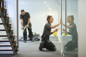 Cleaning professional conducting an ATP test on facility surface 
