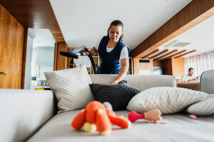 Cleaning technician with disinfection certificate disinfecting surface