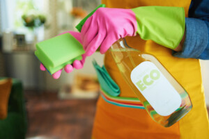 Worker using sustainable cleaning systems in modern building environment