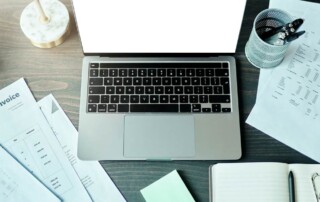 Residential cleaning business plan with laptop and cleaning supplies