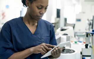 Healthcare professional reviewing Instructions for Use for medical device compliance