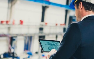 Facility management professional reviewing digital dashboard for building efficiency.